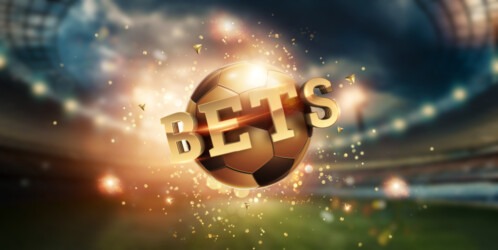 Gold,lettering,bets,with,golden,ball,and,stadium,background.,bets,